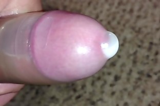 Pissing and cumming in another condom