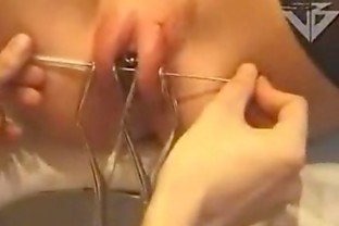 Blonde piercing her pussy