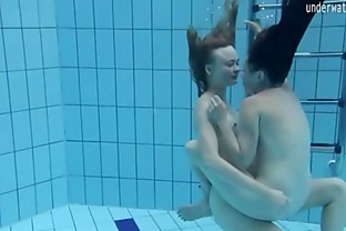 Two hot lesbians in the pool loving eachother