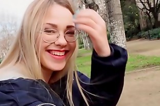 Blonde reading in the public park