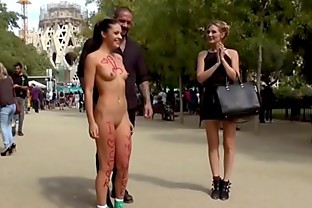 Naked brunette posing in public