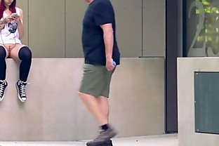 Brunette girl with skateboard flashing in public