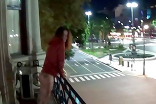 Outdoor public pissing from a balcony in America