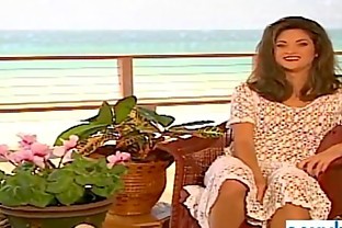 Tanned superbabe rubs herself on sandy beach