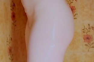 Pale beauty blushes while masturbating in shower