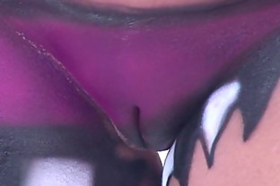 body painted and flashing girls during the day at mardi gras like festival